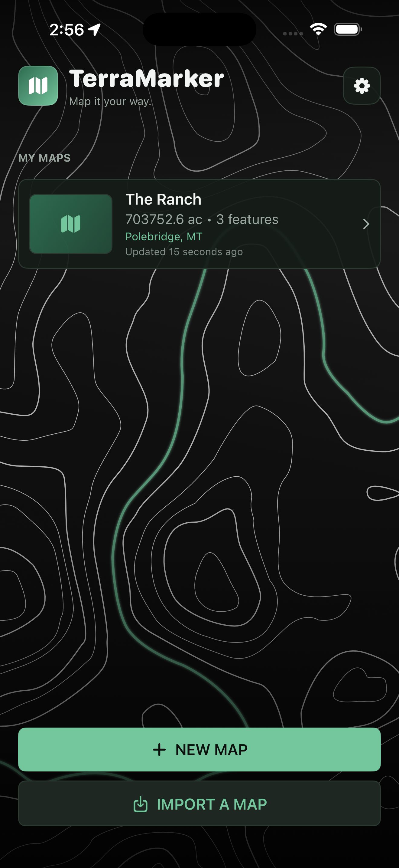 TerraMarker home screen with the saved maps library over a topographic background